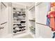 Walk-in closet with custom white shelving providing ample storage at 25340 E Lenox Cir, Punta Gorda, FL 33950