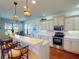 Well-equipped kitchen featuring modern appliances, a breakfast bar, and decorative lighting at 2607 Valerian Way, North Port, FL 34289