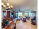 Open-concept living area featuring tile flooring, a view, and access to an outdoor space at 2607 Valerian Way, North Port, FL 34289