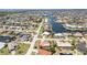 Expansive aerial view of a waterfront community with canals, well-manicured lawns, and beautiful homes at 2621 Via Veneto Dr, Punta Gorda, FL 33950