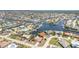 Waterfront neighborhood aerial view with single-Gathering homes, canals, and lush landscaping at 2621 Via Veneto Dr, Punta Gorda, FL 33950