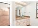 Bathroom featuring a glass vessel sink on a granite countertop and a large mirror at 2621 Via Veneto Dr, Punta Gorda, FL 33950