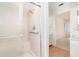 Bathroom showcasing a walk-in shower with grab bar and tiled surround at 2621 Via Veneto Dr, Punta Gorda, FL 33950