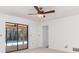 A serene bedroom with sliding glass doors to a screened pool area at 2621 Via Veneto Dr, Punta Gorda, FL 33950