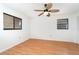 Bedroom featuring laminate flooring, closet, and two windows at 2621 Via Veneto Dr, Punta Gorda, FL 33950