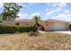 Inviting exterior view of a single Gathering home featuring a well-maintained lawn and landscaping at 2621 Via Veneto Dr, Punta Gorda, FL 33950