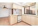 Kitchen view featuring breakfast bar, modern sink, and tile backsplash at 2621 Via Veneto Dr, Punta Gorda, FL 33950