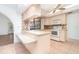 Well-lit kitchen offers a pass-through window and sleek appliances, making meal prep a breeze at 2621 Via Veneto Dr, Punta Gorda, FL 33950