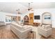 Inviting living room with stylish furnishings, wood-look tile floors, and seamless indoor-outdoor flow at 2621 Via Veneto Dr, Punta Gorda, FL 33950