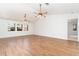Open-concept living room boasts wood-look tile flooring and bright natural light at 2621 Via Veneto Dr, Punta Gorda, FL 33950