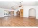 Expansive living room features wood-look tile floors and views of the pool and lanai at 2621 Via Veneto Dr, Punta Gorda, FL 33950