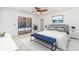 Serene main bedroom with a sliding glass door that leads to a screened lanai and the pool at 2621 Via Veneto Dr, Punta Gorda, FL 33950