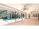 View of the screened-in porch area with access to a pool, enhanced by ceiling fans at 2621 Via Veneto Dr, Punta Gorda, FL 33950