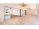 Spacious porch with ceiling fans and floor tiles, leading to the interior through sliding glass doors at 2621 Via Veneto Dr, Punta Gorda, FL 33950