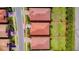 Aerial view of a residential house with tile roof, green lawn, and palm trees in the neighborhood at 264 Soliera St, Nokomis, FL 34275