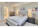 Comfortable bedroom featuring a stylish bed with an upholstered headboard, complementary furniture, and natural light at 264 Soliera St, Nokomis, FL 34275