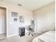 Neutral bedroom with carpeted floor, twin daybed, study desk with chair, and Gathering pictures on the wall at 264 Soliera St, Nokomis, FL 34275