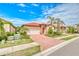 Charming one-story home with tile roof, mature landscaping, palm trees, and a two-car garage at 264 Soliera St, Nokomis, FL 34275