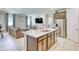 Open-concept kitchen featuring a marble island, stainless steel appliances, and seamless flow to living spaces at 264 Soliera St, Nokomis, FL 34275