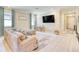 Inviting living room boasts neutral paint, large windows, and comfortable seating for relaxing and entertaining guests at 264 Soliera St, Nokomis, FL 34275