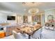 Open-concept living space with modern lighting, dining area, and a seamless flow for entertaining and everyday living at 264 Soliera St, Nokomis, FL 34275