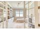 Charming office space featuring built-in bookshelves, desk space, and natural light ideal for work and study at 264 Soliera St, Nokomis, FL 34275