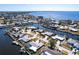Aerial shot of a waterfront property featuring a private boat dock, stunning canal and community views at 275 Tait Se Ter, Port Charlotte, FL 33952