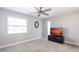 Bedroom with a wall mounted TV, a ceiling fan, and carpeted floors at 275 Tait Se Ter, Port Charlotte, FL 33952