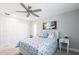 Bright bedroom features a decorative ceiling fan and a closet with white, louvered doors at 275 Tait Se Ter, Port Charlotte, FL 33952