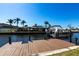 Private waterfront dock with boat, ideal for enjoying waterfront living and recreational boating activities at 275 Tait Se Ter, Port Charlotte, FL 33952