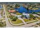 Stunning aerial view of waterfront home with lush landscaping, boat dock, and spacious backyard at 310 Severin Se Rd, Port Charlotte, FL 33952