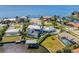 Aerial view showcasing waterfront home, swimming pool, boat lift, and beautiful landscaping at 310 Severin Se Rd, Port Charlotte, FL 33952