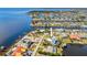 Aerial view of waterfront property highlighting canal access and surrounding neighborhood at 310 Severin Se Rd, Port Charlotte, FL 33952