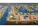 Expansive aerial view showcasing waterfront homes and canal access, highlighting the coastal community at 310 Severin Se Rd, Port Charlotte, FL 33952