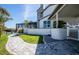 Lush backyard featuring a meticulously landscaped garden, a scenic walking path and stunning architectural details of the home at 310 Severin Se Rd, Port Charlotte, FL 33952