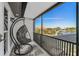 Relaxing balcony with hanging chair and scenic views of the waterway at 310 Severin Se Rd, Port Charlotte, FL 33952