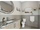 Modern bathroom with sleek vanity, marble countertops, and stylish wall decor at 310 Severin Se Rd, Port Charlotte, FL 33952