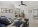 Comfortable bedroom featuring a window view, ceiling fan, and a dresser with mirror at 310 Severin Se Rd, Port Charlotte, FL 33952