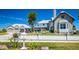 Beautiful two story home with stone accents, landscaped front yard, and three-car garage at 310 Severin Se Rd, Port Charlotte, FL 33952