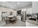 Finished garage features a dining area, kitchen, and modern appliances at 310 Severin Se Rd, Port Charlotte, FL 33952
