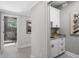 Hallway with access to bathroom and laundry room at 310 Severin Se Rd, Port Charlotte, FL 33952