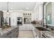 Bright kitchen features stainless steel appliances, a gray island with granite counters, and ample cabinet space at 310 Severin Se Rd, Port Charlotte, FL 33952
