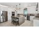 Modern kitchen featuring stainless steel appliances, island seating, and sleek finishes at 310 Severin Se Rd, Port Charlotte, FL 33952