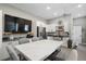 Bright kitchenette with white cabinets, stainless steel appliances, and a large island at 310 Severin Se Rd, Port Charlotte, FL 33952