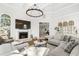 Bright living room boasts high ceilings, fireplace, and abundant natural light at 310 Severin Se Rd, Port Charlotte, FL 33952