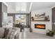 Living room featuring fireplace and dining area with views of the outdoors at 310 Severin Se Rd, Port Charlotte, FL 33952