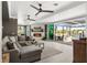 Cozy living room with fireplace opens to a screened lanai with water views at 310 Severin Se Rd, Port Charlotte, FL 33952