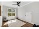 Minimalist home office boasts ample natural light and durable wood flooring at 310 Severin Se Rd, Port Charlotte, FL 33952