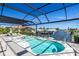 Screened pool with hot tub and a beautiful view of the canal and boat dock at 310 Severin Se Rd, Port Charlotte, FL 33952