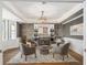 Inviting sitting area features custom bar with wine storage and statement lighting at 310 Severin Se Rd, Port Charlotte, FL 33952